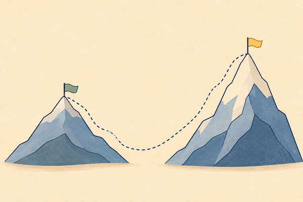 Two mountains side by side with flags on top, the second taller and steeper, joined by a dotted path