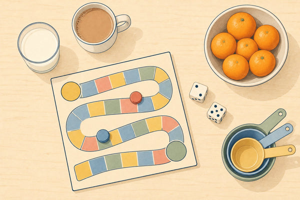 A kitchen table with a board game, dice, measuring cups and a bowl of clementines